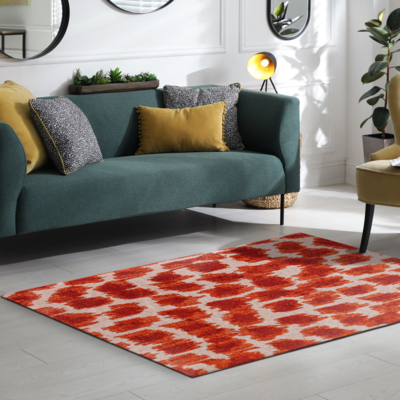 Abstract design vloerkleed Ikat met vlekken en vage vormen oranje en ivoor
