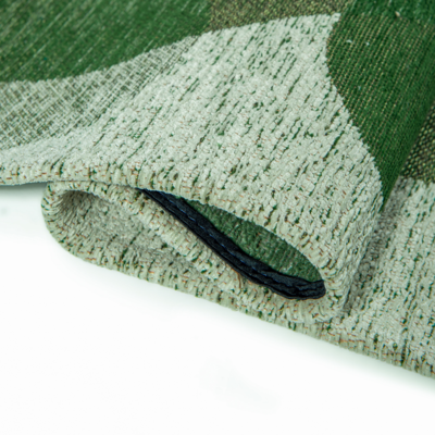 Groen tapijt met willekeurige, ronde vormen en een "Café" bonenmotief